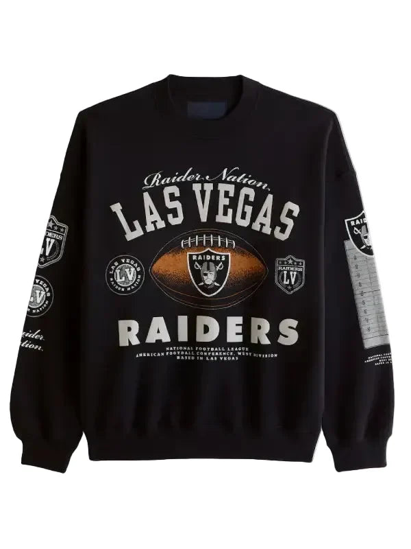 A black crewneck sweatshirt featuring the Las Vegas Raiders logo and name in white and silver, with a central brown football graphic, shown on a light gray background.