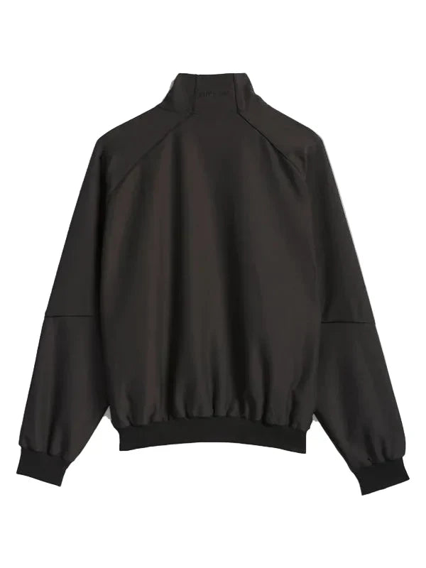 A black lightweight bomber jacket with a mock neck, raglan sleeves, and elasticized cuffs and hem, shown from the back on a light gray background.